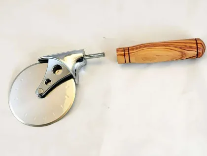Alligator-juniper pizza cutter with stainless wheel, shown disassembled.